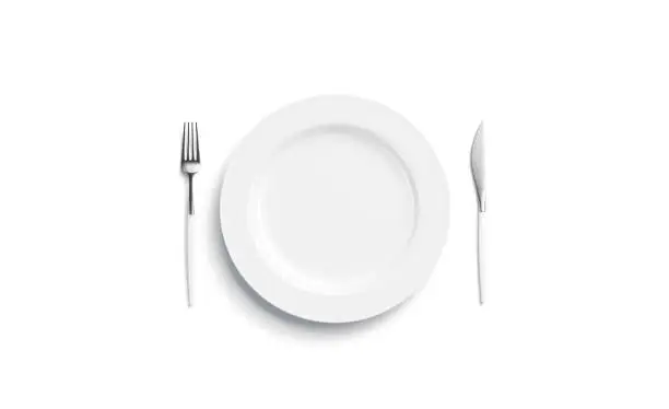 Photo of Blank white plate mockup with fork and knife, side view