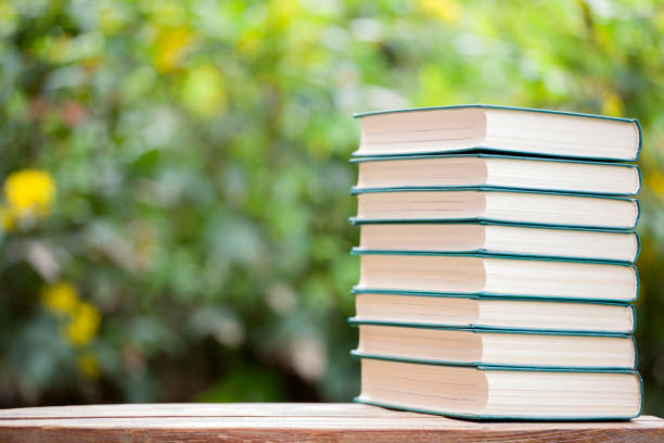 istock book wooden table tree bokeh nobody 1149283242