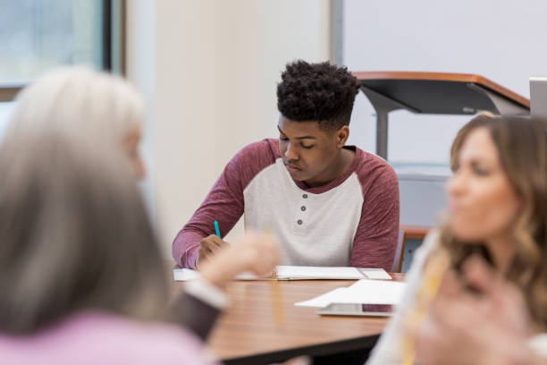 istock Teen African American boy does his homework 1149285528