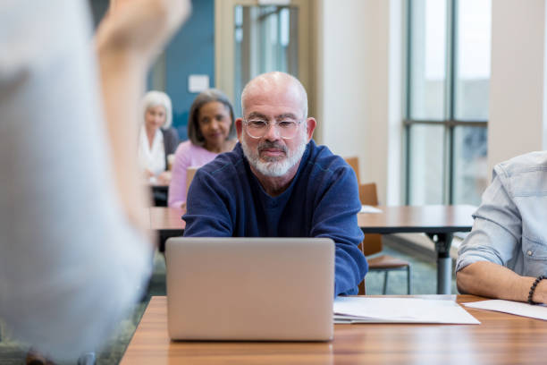 istock Mature adult student concentrates on classwork 1149286201