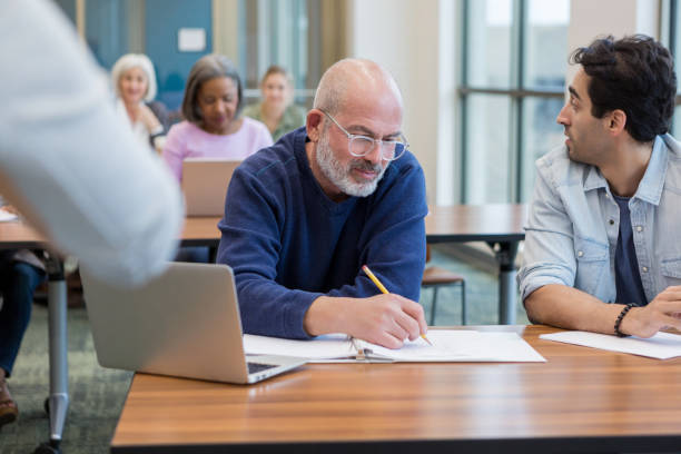 istock Mid adult man is distracted, mature man is working 1149286202