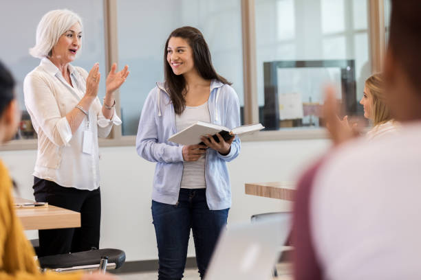 istock Everybody applauds teen student after presentation 1149286301