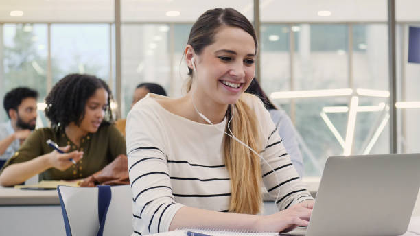 istock Hispanic college girl studies in library 1149286324