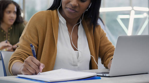 istock Confident female college student studies in library 1149286329