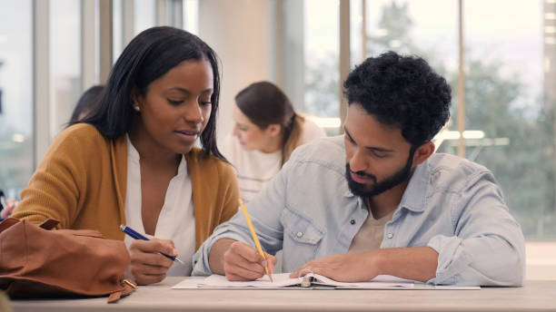 istock Male and female college students work on assignment 1149286348