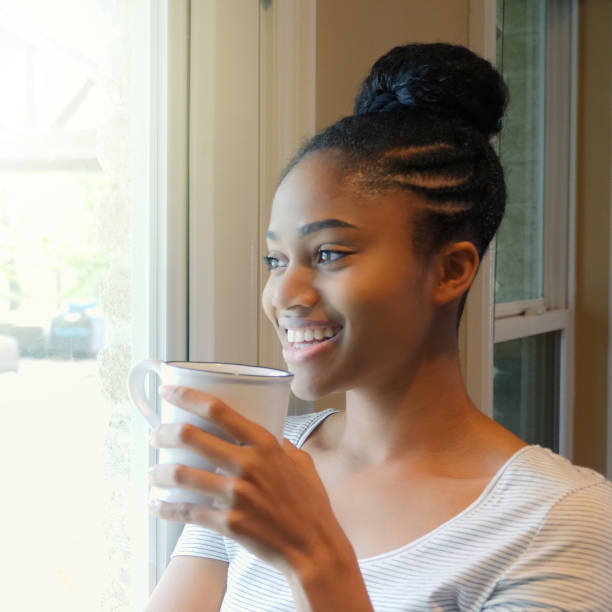 istock Smiling young woman relaxes at home 1149286476