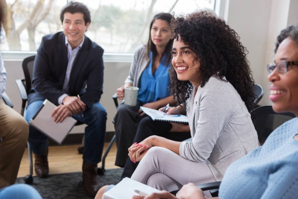 istock A diverse group of professionals focus on an unrecognizable person. 1149286626