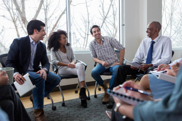 istock Diverse team relaxes after a meeting 1149286655