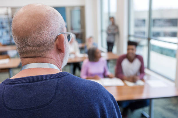 istock High school principal talks to parents and students 1149286750