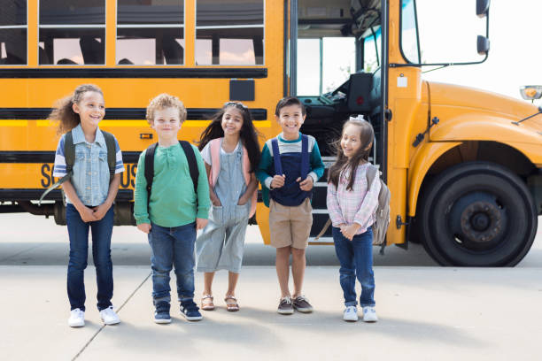 istock Multi-ethnic group of elementary school children poses for photo 1149286849