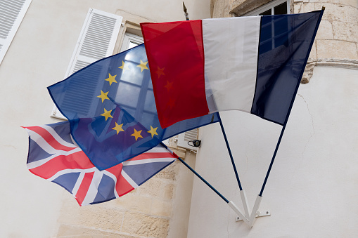 French uk English brexit and the European Union flag waving in the wind