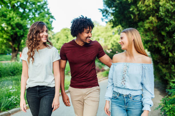 istock A group of three friends walking in the park 1149291803