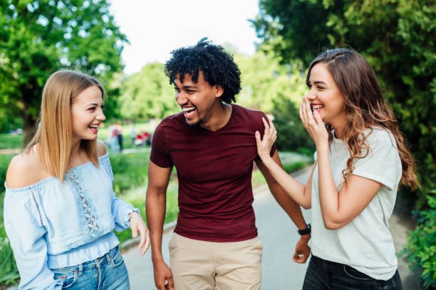 istock A group of three friends walking in the park 1149291810