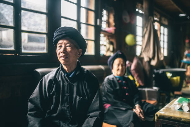 istock old chinese minority couple at home 1149293136