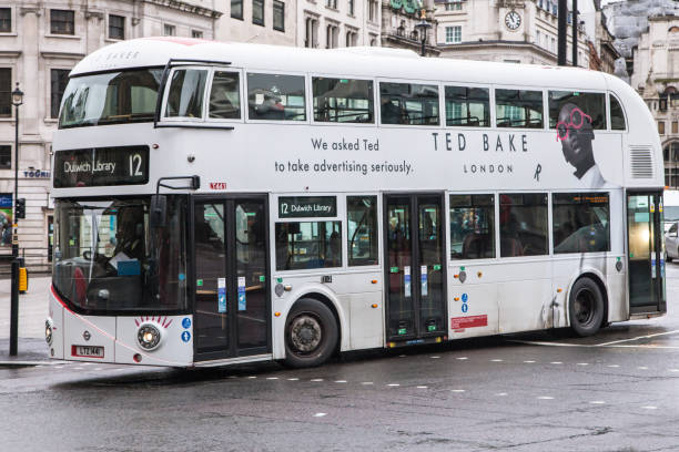 New Routemaster in White Livery at Trafalgar Square London, United Kingdom - December 23, 2019: Wrightbus New Routemaster in white livery travelling around Trafalgar Square heading towards Dulwich Library on route 12, London, United Kingdom. boris bus stock pictures, royalty-free photos & images