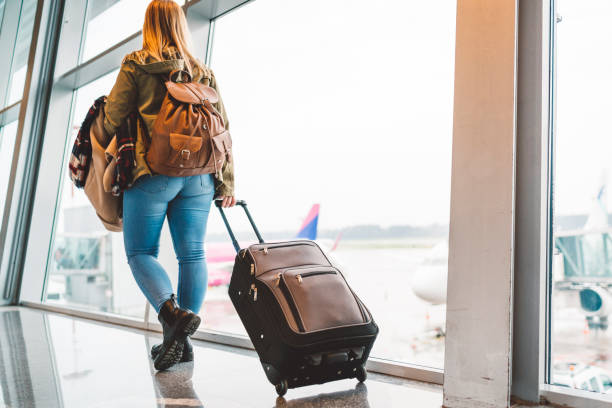 istock Young girl carrying her luggage 1149294514