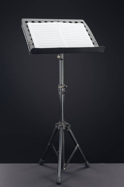 istock opened music book on stand on black background 1149294684