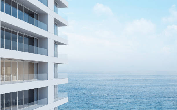 istock Perspective of high-rise condominium building with sea view background - 3D rendering - Illustration 1149294754