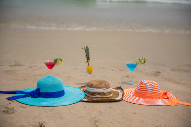 istock cocktails and hats at beach 1149294884
