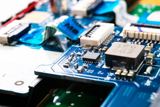 istock Macro shot of Circuit board with resistors microchips and electronic components. Computer hardware technology. Integrated communication processor. Information engineering. Semiconductor. PCB. Closeup 1149294892