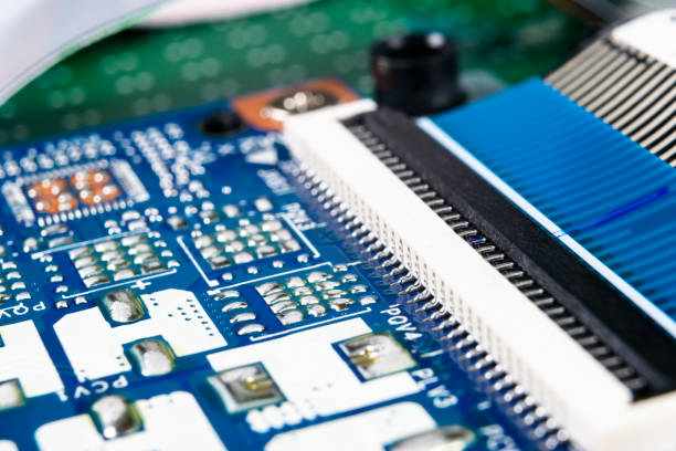 istock Macro shot of Circuit board with resistors microchips and electronic components. Computer hardware technology. Integrated communication processor. Information engineering. Semiconductor. PCB. Closeup 1149294974