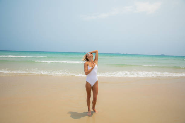 istock young woman being spoiled at beach 1149295225