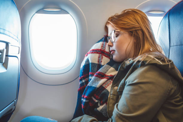 istock Young woman sleeping on board 1149295296