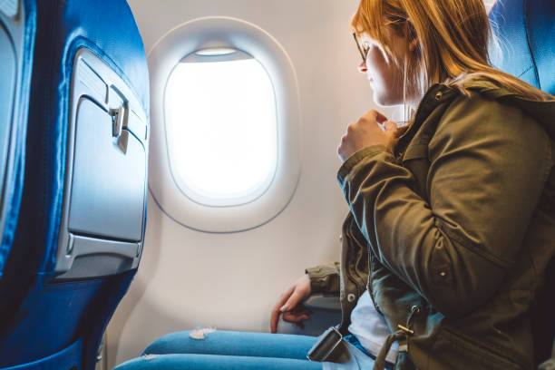 istock Sitting on a plane and looking outside the window 1149296216