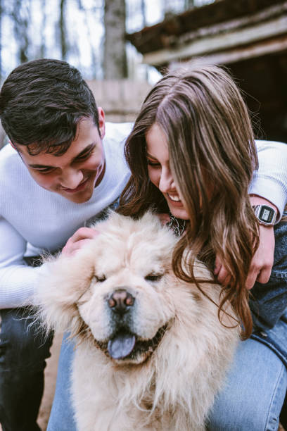 istock Young Couple And Their Chow Dog Having Fun 1149296487