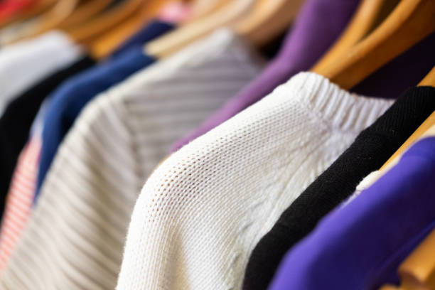 Rack of Sweaters in Second Hand Store Thrift Store, Flea Market, UK, Charitable Donation, Clothing fashion bazaar stock pictures, royalty-free photos & images