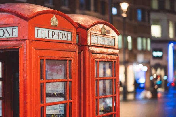 istock Old London telephone booths at night 1149296749