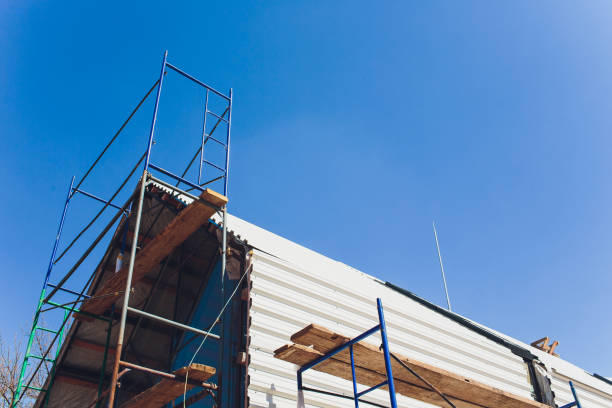 istock Scaffold between floors and interior partitions in construction building aerial view. Employees working on construction site of high rise building. 1149297821