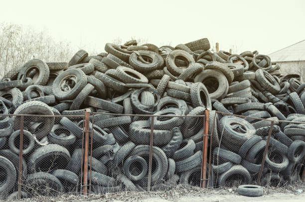 istock Old used damaged car tires at the dump 1149298347