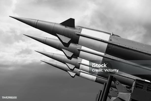 Balistic Rockets War Background Nuclear Missiles With Warhead Aimed At Gloomy Sky Stock Photo - Download Image Now