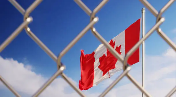 Photo of Fence In Front Of Canadian Flag