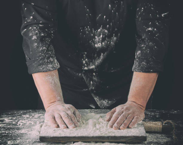 istock cook  put two hands on a table sprinkled with white wheat flour 1149299181