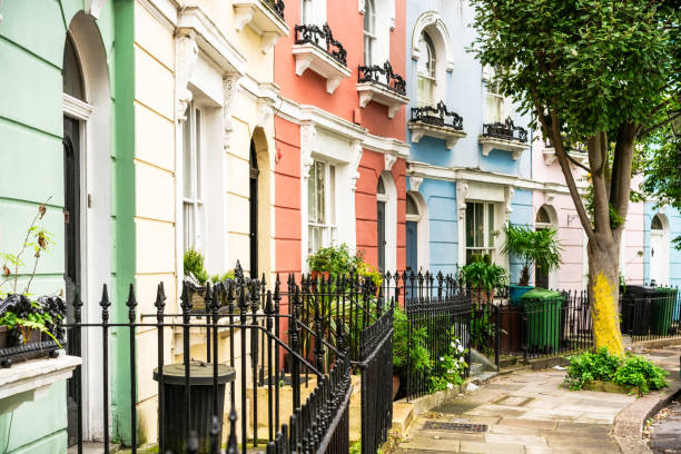 Colourful corner of Chelsea, London Houses painted in different pastel tones, in the corner of a street in Chelsea, London. notting hill photos stock pictures, royalty-free photos & images