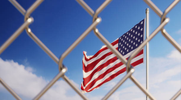 istock Fence In Front Of American Flag 1149299552