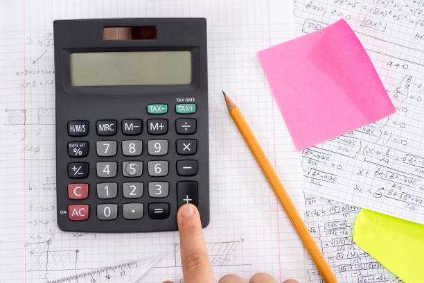 istock Finger on the Calculator Button During Mathematical Lesson. School Concept. 1149299871