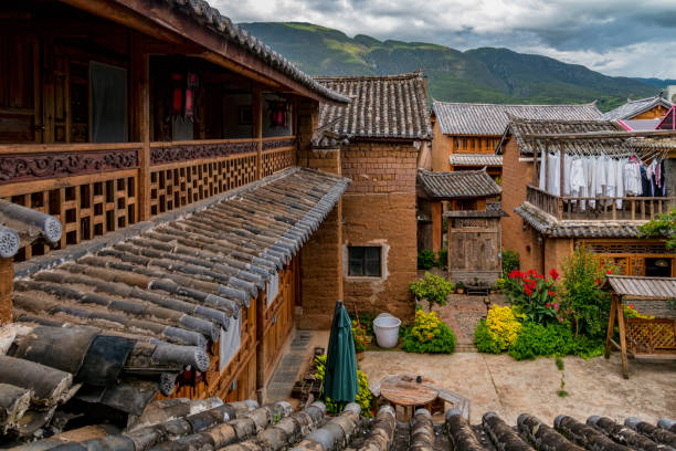 Historic Residential Courtyard in Traditional Chinese Village. Shaxi is a historic market town in Jianchuan County, Dali Prefecture, Yunnan province, China. It is located roughly halfway between Dali and Lijiang. yunnan province stock pictures, royalty-free photos & images