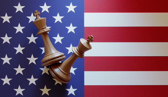 King chess pieces over American flag. Horizontal composition with copy space.