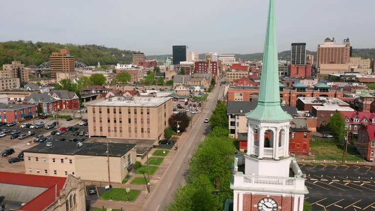 Aerial Elevating Up Over a Chruch Clocktower and Charleston West Virginia