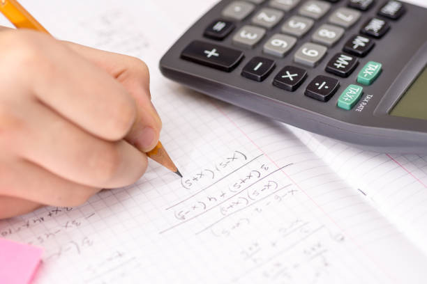 istock Schoolboy Hands with Ruler Drawing on Paper. Mathematics Concept. 1149305049