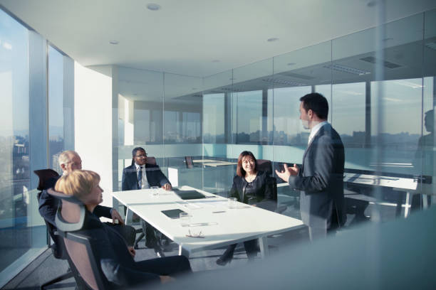istock Businessman talking with colleagues in meeting 1149306425