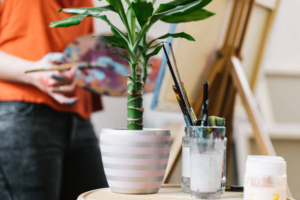istock Female Artist painting in her studio 1149308367