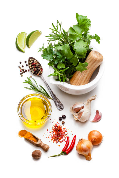 cooking and seasoning ingredients: olive oil, vegetables, herbs and spices on white background. - mortar and pestle condiment isolated food imagens e fotografias de stock