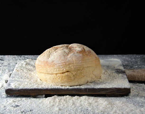 istock round baked bread and white wheat flour 1149309523