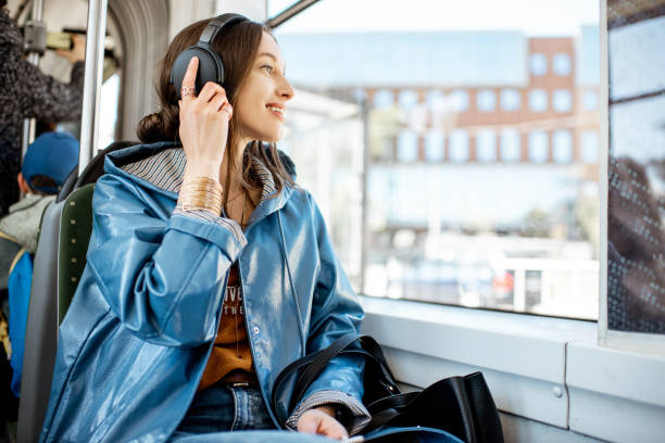 公共交通機関を利用した女性旅客 - bus transportation indoors people ストックフォトと画像