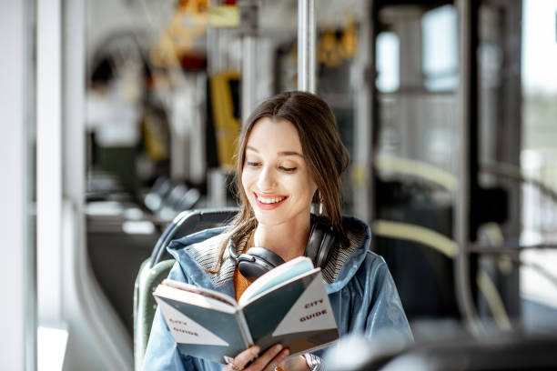 passeggera che utilizza i mezzi pubblici - bus transportation indoors people foto e immagini stock