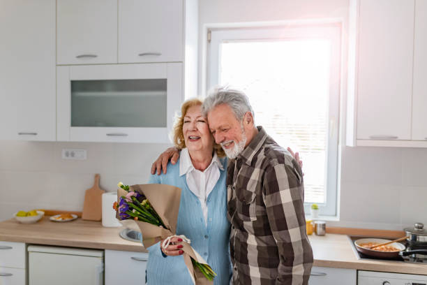 istock Happy elderly couple celebrating wedding anniversary 1149314015